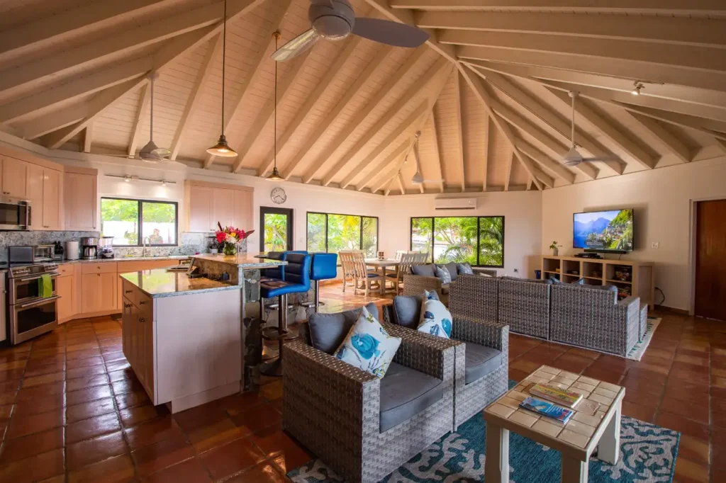 Open-plan great room inside Beach Dreams, a BVI luxury villa with kitchen and lounge area