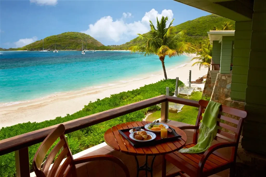 Beachfront accommodation at Peter Island Resort overlooking turquoise waters