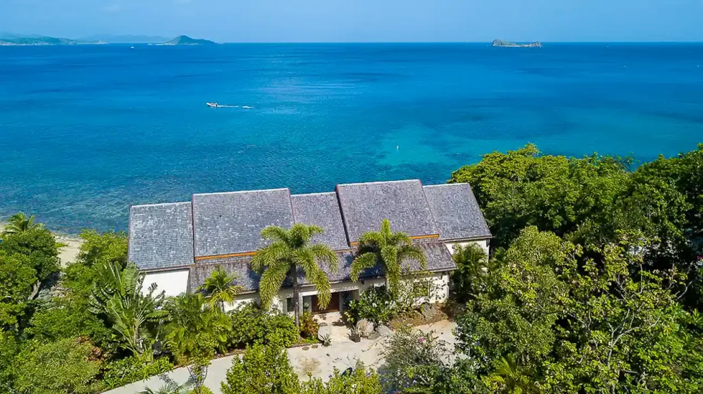 Oceanfront villa surrounded by tropical gardens 