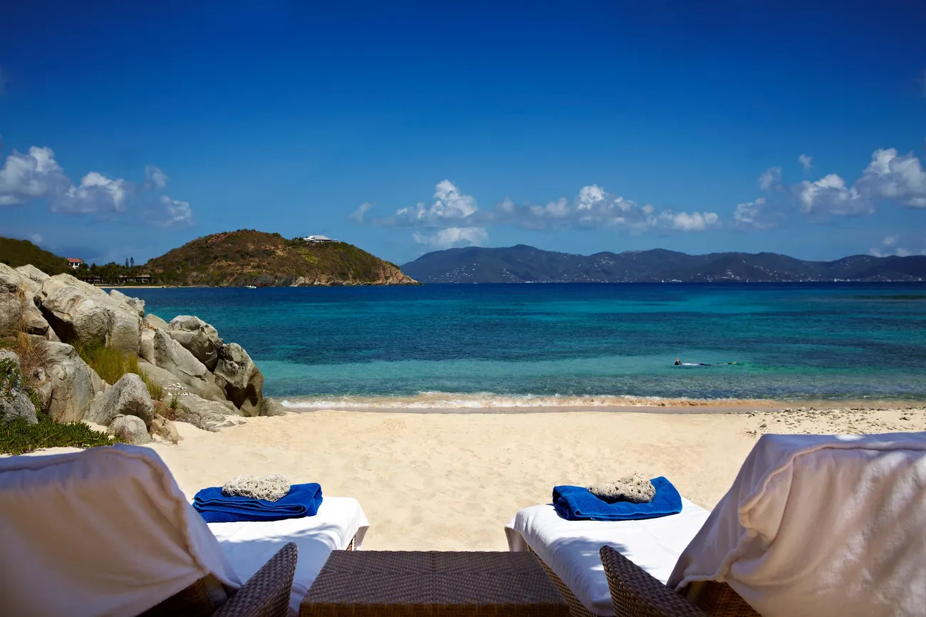Honeymoon Beach overlooking crystal-clear Caribbean waters at Peter Island