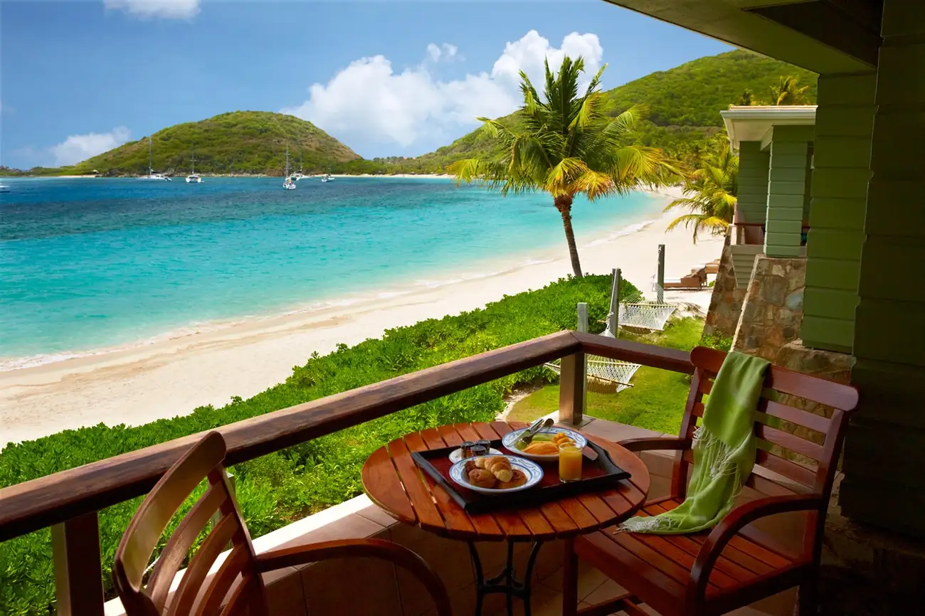Beachfront accommodation at Peter Island overlooking turquoise waters
