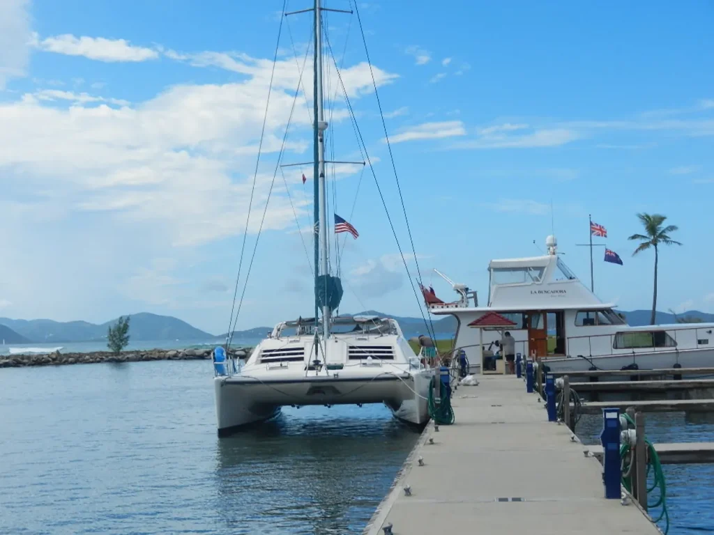 Catamaran docked at Virgin Gorda marina during a Christmas in July BVI getaway